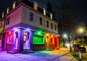 Exterior of Unicorn Bar, with rainbow lighting